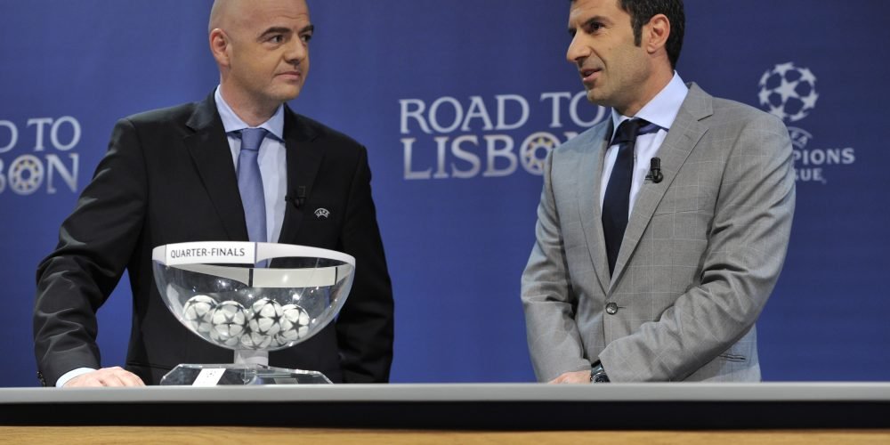 NYON, SWITZERLAND - MARCH 21:  UEFA General Secretary Gianni Infantino and Ambassador for the final Luis Figo proceed to the UEFA Champions League 2013/14 season quarter-finals draw at the UEFA headquarters, The House of European Football, on March 21, 2014 in Nyon, Switzerland.  (Photo by Harold Cunningham/Getty Images for UEFA)