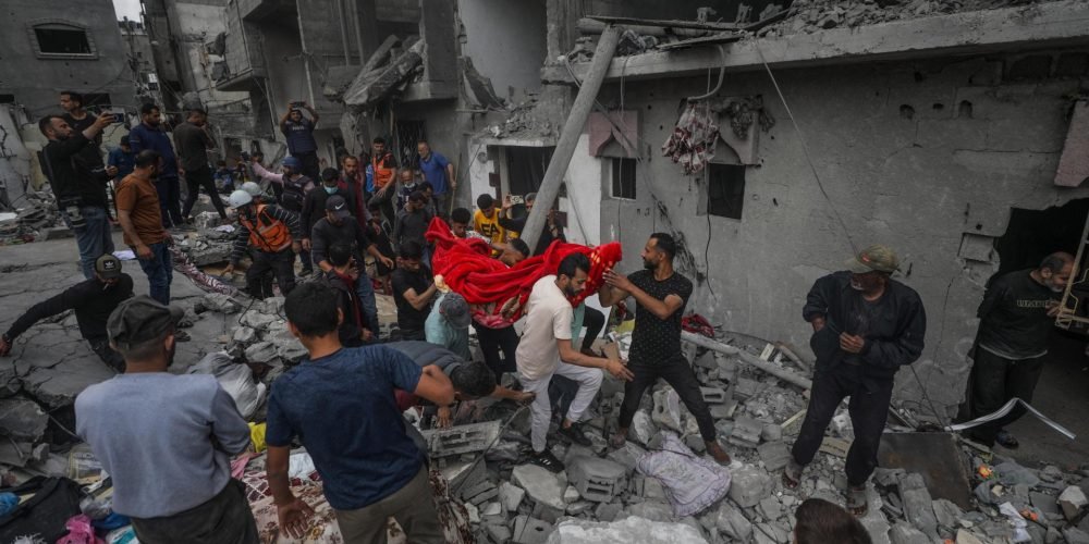 Al Nusairat (---), 27/04/2024.- Palestinians recover the remains of a woman amidst the rubble of a destroyed house following an Israeli air strike in Al Nusairat refugee camp, southern Gaza Strip, 27 April 2024. More than 34,300 Palestinians and over 1,455 Israelis have been killed, according to the Palestinian Health Ministry and the Israel Defense Forces (IDF), since Hamas militants launched an attack against Israel from the Gaza Strip on 07 October 2023, and the Israeli operations in Gaza and the West Bank which followed it. EFE/EPA/MOHAMMED SABER